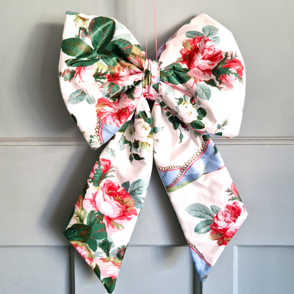 Floral patterned bow on a gray background