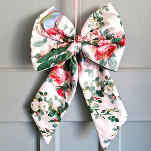 Floral bow on a gray door