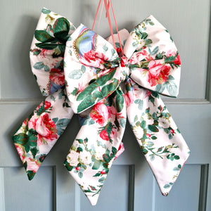 Floral decorative bow on a gray door