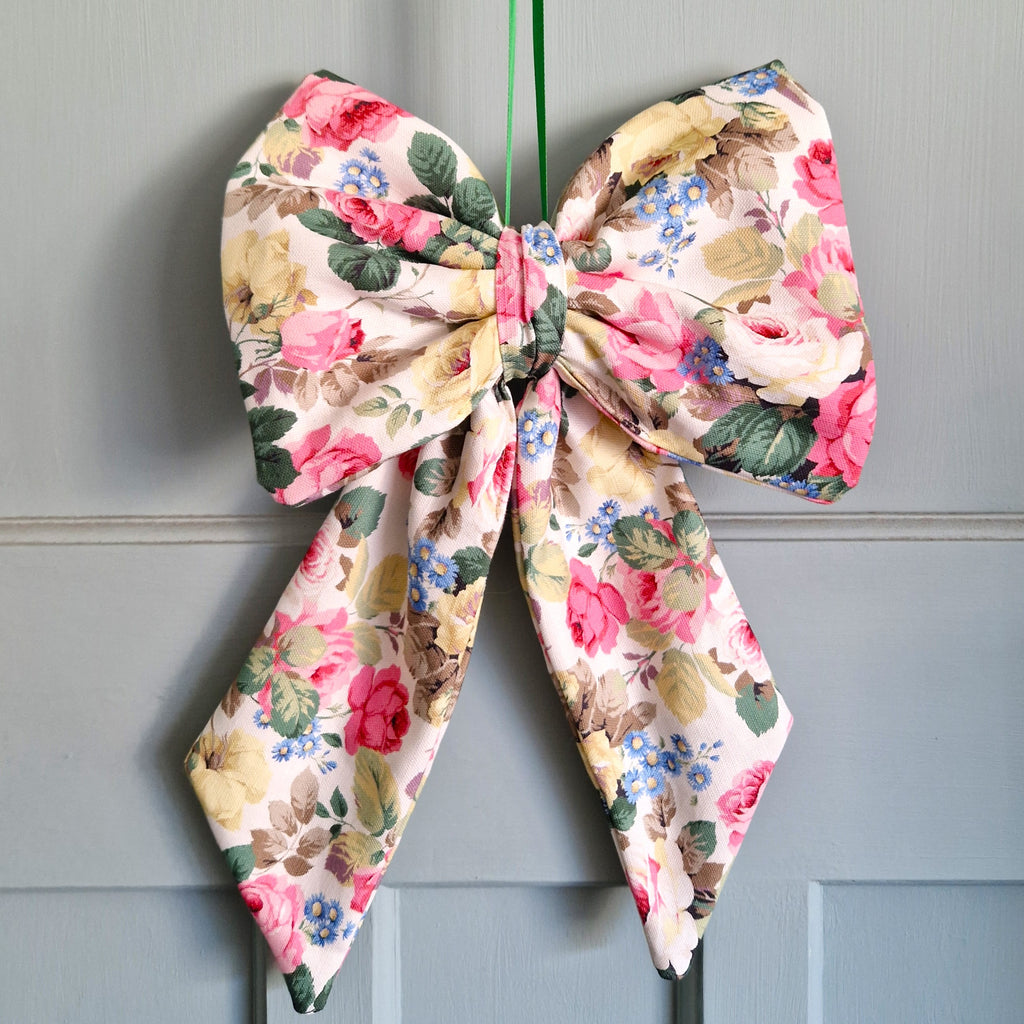 Floral-patterned bow on a gray background